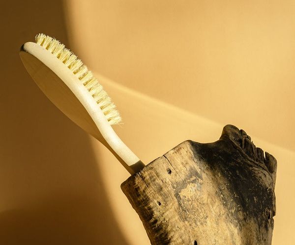 A calm and clean studio with wooden floors and ample natural light.