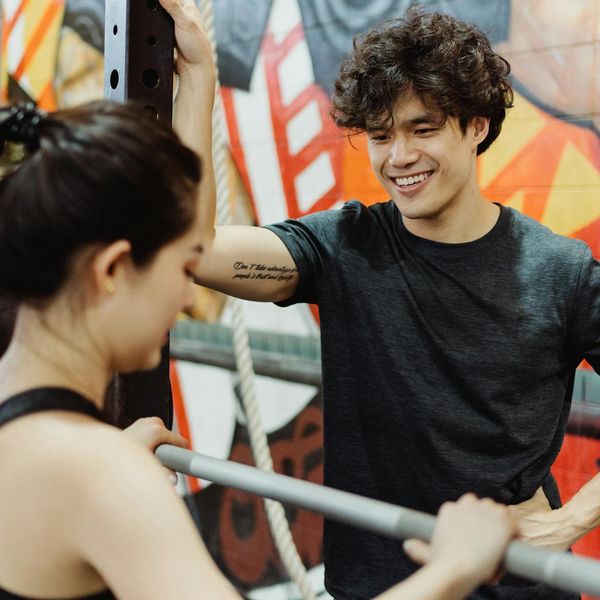 Man smiling and looking refreshed after a light workout session.